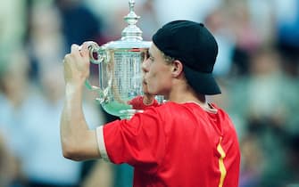 NEW YORK, UNITED STATES - SEPTEMBER 09: Lleyton Hewitt of Australia kisses the winners trophy after defeating Pete Sampras of USA during the Men's Singles Final at the United States Open in Flushing, New York on September 9th, 2001 in New York, United States of America. (Photo by Simon Bruty/Anychance/Getty Images)