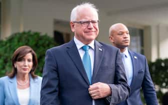 tim walz epa11456050 Minnesota Governor Tim Walz (C), New York Governor Kathy Hochul (L) and Maryland Governor Wes Moore (R) walk out of the West Wing to deliver remarks to the news media following their meeting with US President Joe Biden at the White House in Washington, DC, USA, 03 July 2024. President Biden is meeting with key Democratic allies as he tries to control the damage from his poor debate performance. EPA/SHAWN THEW