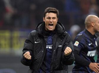 MILAN, ITALY - DECEMBER 22:  Javier Zanetti of FC Inter Milan celebrates victory at the end of the Serie A match between FC Internazionale Milano and AC Milan at San Siro Stadium on December 22, 2013 in Milan, Italy.  (Photo by Claudio Villa/Getty Images)