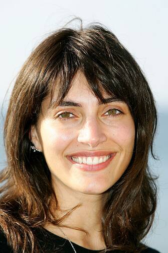 Actress Caterina Murino poses for the photocall of "L'Amour aux Trousses" at Cabourg Festival 2005. (Photo by Eddy LEMAISTRE/Corbis via Getty Images)