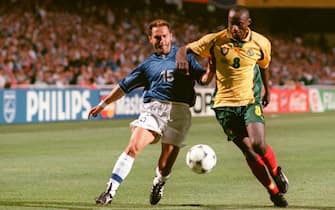 Angelo Di Livio of Italy (left) battles for the ball with Didier Angibeaud of Cameroon (right)  (Photo by Tony Marshall/EMPICS via Getty Images)
