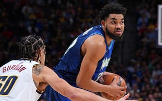 DENVER, CO - APRIL 1: Karl-Anthony Towns #32 of the Minnesota Timberwolves looks to pass the ball during the game against the Denver Nuggets on April 1, 2022 at the Ball Arena in Denver, Colorado. NOTE TO USER: User expressly acknowledges and agrees that, by downloading and/or using this Photograph, user is consenting to the terms and conditions of the Getty Images License Agreement. Mandatory Copyright Notice: Copyright 2022 NBAE (Photo by Garrett Ellwood/NBAE via Getty Images)