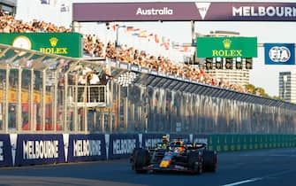 MELBOURNE GRAND PRIX CIRCUIT, AUSTRALIA - APRIL 02: Max Verstappen, Red Bull Racing RB19, 1st position, leads Sir Lewis Hamilton, Mercedes F1 W14, 2nd position, as the chequered flag is waved during the Australian GP at Melbourne Grand Prix Circuit on Sunday April 02, 2023 in Melbourne, Australia. (Photo by Jake Grant / LAT Images)