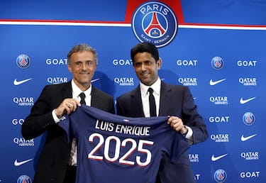 epa10727747 Spanish coach Luis Enrique (L) poses with Nasser Al-Khelaïfi, Chairman and CEO of Paris Saint-Germain, during his presentation as new head coach of PSG at the new training center of Paris Saint-Germain in Poissy, west of Paris, France 05 July 2023.  EPA/YOAN VALAT
