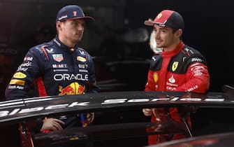 AUTÃ³DROMO JOSÃ© CARLOS PACE, BRAZIL - NOVEMBER 03: Pole man Max Verstappen, Red Bull Racing, and Charles Leclerc, Scuderia Ferrari, talk after Qualifying during the Brazilian GP at AutÃ³dromo JosÃ© Carlos Pace on Friday November 03, 2023 in Sao Paulo, Brazil. (Photo by Zak Mauger / LAT Images)
