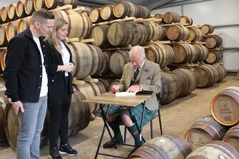 WICK, SCOTLAND - AUGUST 2: King Charles III, with the distillery owners Kerry and Derek Campbell, during a visit to the 8 Doors Distillery in John O'Groats, Wick, in the Scottish Highlands, to officially open the distillery and meet members of the local business community on August 2, 2023 in Wick, Scotland. (Photo by Robert MacDonald - Pool/Getty Images)