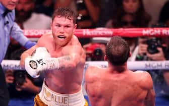 (L-R) Canelo Alvarez punches Caleb Plant during their WBA/WBC/WBO super-middleweight 168-pound title fight at the MGM Grand Garden Arena on November 6, 2021, in Las Vegas, NV, USA. Photo by Alejandro Salazar/PxImages/ABACAPRESS.COM