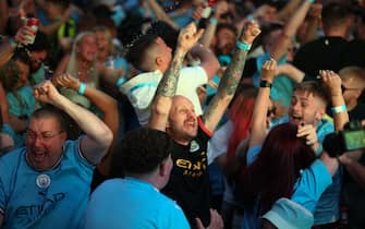 epa10684328 Manchester City fans react during the UEFA Champions League final between Manchester City and Inter Milan, at the 4TheFans fan park in Manchester, Britain, 10 June 2023.  EPA/ADAM VAUGHAN