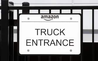 epa10185040 An Amazon 'Truck Entrance' sign is photographed at the entrance of an Amazon logistics hub in Los Angeles, California, USA, 14 December 2022. California's attorney general, Rob Bonta, filed an antitrust lawsuit against Amazon alleging that the company stifles price competition.  EPA/ETIENNE LAURENT
