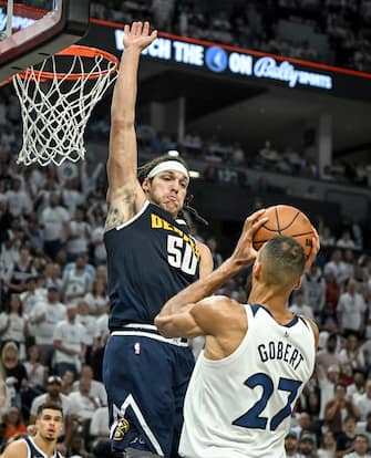 MINNEAPOLIS , MN - MAY 12: Aaron Gordon (50) of the Denver Nuggets defends Rudy Gobert (27) of the Minnesota Timberwolves during the fourth quarter of the Nuggets' 115-107 win at Target Center in Minneapolis, Minnesota on Sunday, May 12, 2024. (Photo by AAron Ontiveroz/The Denver Post)