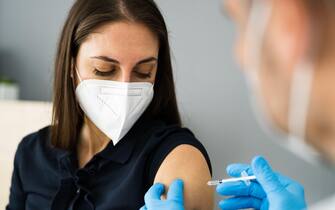 Covid Vaccine Injection By Doctor In Face Mask
