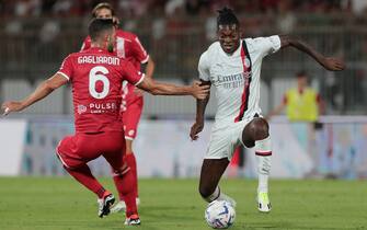 MONZA, ITALY - AUGUST 08: Rafael Leao of AC Milan is challenged by Roberto Gagliardini of AC Monza during the Trofeo Silvio Berlusconi pre-season friendly match between AC Monza and AC Milan at U-Power Stadium on August 08, 2023 in Monza, Italy. (Photo by Emilio Andreoli/Getty Images)