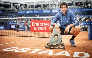 Italy's Matteo Berrettini poses with the trophy after winning the final match against France's Quentin Halys at the Swiss Open tennis tournament in Gstaad, on July 21, 2024. (Photo by GABRIEL MONNET / AFP) (Photo by GABRIEL MONNET/AFP via Getty Images)