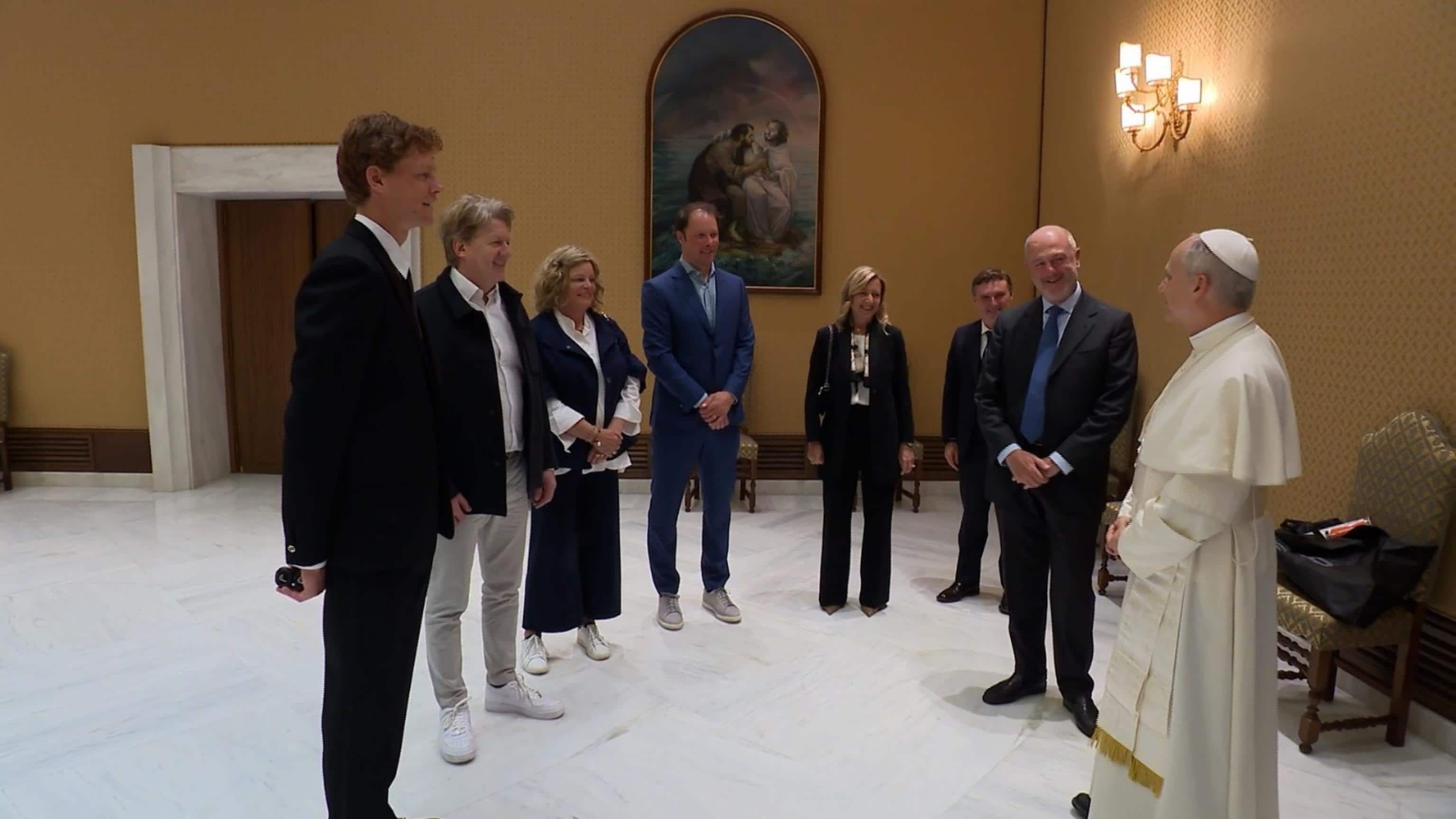 A frame extracted from a video distributed by Vatican Media shows Italian tennis player Jannik Sinner giving a tennis racket to the Pope. The champion had his own and a ball and asked Leone: "Do you want to play?" The Pope showed him the room with lamps and other furniture and laughingly replied: "Let's leave it, it's better not to here". Leone also added laughing: "At Wimbledon they would let me...", meaning that on the famous British court they would let him play with the new racket. Rome, 14 May 2025. ANSA / VATICAN MEDIA HANDOUT