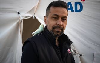 KAHRAMANMARAS, TURKIYE - FEBRUARY 24: Mesut Keten, an earthquake survivor lives the tent city established in Vali Saim Cotur Stadium and around with his parakeet named "Boncuk" after 7.7 and 7.6 magnitude earthquakes hit multiple provinces of Turkiye including Kahramanmaras on February 24, 2023. Some survivors of earthquakes in Kahramanmaras live together in a tent city with their animals, such as fish, birds, partridges, cats and dogs, which they rescued while leaving their homes. Established by the Sakarya 7th Commando Brigade Command, the tent city hosts nearly 3,500 earthquake victims as well as dozens of pets. (Photo by Fatih Kurt/Anadolu Agency via Getty Images)