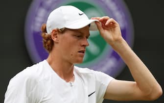 epa10739795 Jannik Sinner of Italy in action against Roman Safiullin of Russia during their Men's Singles quarter final match at the Wimbledon Championships, Wimbledon, Britain, 11 July 2023.  EPA/ISABEL INFANTES   EDITORIAL USE ONLY