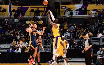 LOS ANGELES, CA - MAY 19: LeBron James #23 of the Los Angeles Lakers shoots a three point basket to win the game against the Golden State Warriors during the 2021 NBA Play-In Tournament on May 19, 2021 at STAPLES Center in Los Angeles, California. NOTE TO USER: User expressly acknowledges and agrees that, by downloading and/or using this Photograph, user is consenting to the terms and conditions of the Getty Images License Agreement. Mandatory Copyright Notice: Copyright 2021 NBAE (Photo by Adam Pantozzi/NBAE via Getty Images)