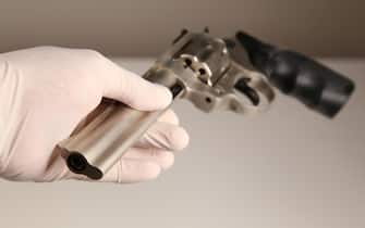 Close Up Shot of Gun in Crime Scene