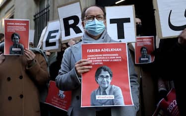 Colleagues of the French-Iranian academic Fariba Adelkhah, hold placards depicting her as they gather in front high education school Science-Po, in Paris, on January 13, 2022 in order to support her following the decision of the Iranian government to send her back to prison after a period of house arrest. - Adelkhah was sentenced in May 2020 to five years in prison for conspiring against national security, accusations that her supporters have always denounced as absurd. (Photo by Thomas COEX / AFP) (Photo by THOMAS COEX/AFP via Getty Images)