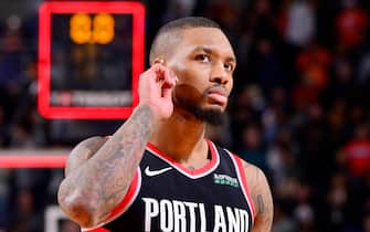 PHOENIX, AZ - DECEMBER 16: Damian Lillard #0 of the Portland Trail Blazers looks on during the game against the Phoenix Suns on December 16, 2019 at Talking Stick Resort Arena in Phoenix, Arizona. NOTE TO USER: User expressly acknowledges and agrees that, by downloading and or using this photograph, user is consenting to the terms and conditions of the Getty Images License Agreement. Mandatory Copyright Notice: Copyright 2019 NBAE (Photo by Barry Gossage/NBAE via Getty Images)