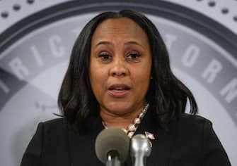 TOPSHOT - District Attorney Fani Willis holds a press conference in the Fulton County Government Center after a grand jury voted to indict former US President Donald Trump and 18 others on August 14, 2023, in Atlanta, Georgia. The Georgia prosecutor who brought sweeping charges against former president Donald Trump and 18 other defendants said Monday, August 14, that she wants to hold their trial "within the next six months."
Fulton County District Attorney Fani Willis said arrest warrants had been issued for Trump and the others charged over their efforts to overturn the 2020 election and they had until August 25 to "voluntarily surrender." (Photo by Christian MONTERROSA / AFP) (Photo by CHRISTIAN MONTERROSA/AFP via Getty Images)