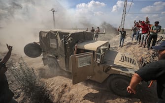 GAZA CITY, GAZA - OCTOBER 7: Israeli military vehicle is seized by the Palestinians as the clashes between Palestinian groups and Israeli forces continue in Gaza City, Gaza on October 7, 2023. (Photo by Mustafa Hassona/Anadolu Agency via Getty Images)