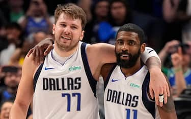 DALLAS, TEXAS - APRIL 07: Luka Doncic #77 and Kyrie Irving #11 of the Dallas Mavericks embrace after defeating the against the Houston Rockets in overtime at American Airlines Center on April 07, 2024 in Dallas, Texas. NOTE TO USER: User expressly acknowledges and agrees that, by downloading and or using this photograph, User is consenting to the terms and conditions of the Getty Images License Agreement. (Photo by Sam Hodde/Getty Images)