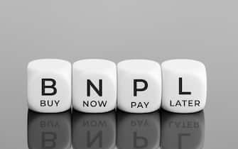 BNPL text on white blocks shape. Buy now pay later concept. Copy space