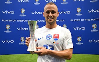 FRANKFURT AM MAIN, GERMANY - JUNE 17: Stanislav Lobotka of Slovakia poses for a photo with the Vivo Player of the Match award after the UEFA EURO 2024 group stage match between Belgium and Slovakia at Frankfurt Arena on June 17, 2024 in Frankfurt am Main, Germany. (Photo by Alexander Scheuber - UEFA/UEFA via Getty Images)