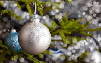 Decoration bauble on decorated Christmas tree