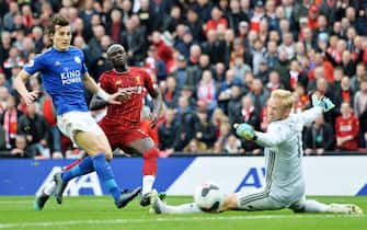 epa07898200 Sadio Mane (C) of Liverpool scores the opening goal against goalkeeper Kasper Schmeichel (R) and defender Caglar Soyuncu (L) of Leicester during the English Premier League match between Liverpool FC and Leicester City at Anfield, Liverpool, Britain, 05 October 2019.  EPA/PETER POWELL EDITORIAL USE ONLY. No use with unauthorized audio, video, data, fixture lists, club/league logos or 'live' services. Online in-match use limited to 120 images, no video emulation. No use in betting, games or single club/league/player publications