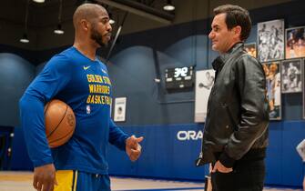 SAN FRANCISCO, CALIFORNIA - MARCH 9: Roger Federer speaks with Chris Paul of the Golden State Warriors before a game while promoting the Laver Cup San Francisco Launch for 2025 at Chase Center on March 9, 2024 in San Francisco, California. (Photo by Loren Elliott/Getty Images for Laver Cup)