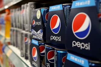 Packaged cans of PepsiCo Inc. Pepsi soda are displayed for sale at an E-Mart Co. store, a subsidiary of Shinsegae Co., in Incheon, South Korea, on Saturday, Dec. 21, 2013. Consumer prices climbed 0.9 percent in November from a year earlier after a 0.7 percent increase in October that was the smallest gain since July 1999. Photographer: SeongJoon Cho/Bloomberg via Getty Images
