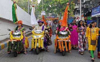 MUMBAI, MAHARASHTRA, INDIA - 2023/03/22: Maharashtrian people dressed in traditional clothes ride motorcycles during a Gudi Padwa procession in Mumbai. Gudi Padwa is the first day of the new year celebrated by Maharashtrians and Kokani Hindus which marks the new beginnings and arrival of the spring season. (Photo by Ashish Vaishnav/SOPA Images/LightRocket via Getty Images)