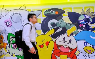 TOKYO, JAPAN - 2023/04/14: A customer walks past Pokemon Store illustrations at Tokyo Station. The Pokemon Go Plus wearable accessory completely sold out online and at the company's stores. Nintendo has announced that it will release new stock soon. The device vibrates and blinks to alert users of Pokemon Go when they are near a Poke Stop or wild Pokemon. (Photo by James Matsumoto/SOPA Images/LightRocket via Getty Images)