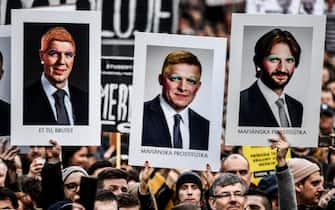 epaselect epa06608463 People hold banners of re-painted portraits of Slovakia's Prime Minister Robert Fico (C) and Interior Minister Robert Kalinak (R) as they participate in a rally called 'Let's stand for decency in Slovakia' in Bratislava, Slovakia, 16 March 2018. Mass street protests in SLovakia started after the murder of journalist Jan Kuciak and his fiance Martina Kusnirova. Protesters are asking for an independent investigation into the murders and new, trustworthy government that will not include people suspected of corruption  EPA/CHRISTIAN BRUNA