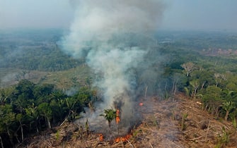Smoke from illegal fires lit by farmers rises in Manaquiri, Amazonas state, on September 6, 2023. From September 2, 2023 to September 6, 2023, 2,500 forest fires in Amazon state alone were recorded by INPE, Brazil's National Institute for Space Research. (Photo by MICHAEL DANTAS / AFP) (Photo by MICHAEL DANTAS/AFP via Getty Images)