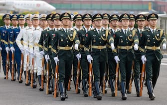 Members of the Chinese guard of honour arrive for the welcome ceremony of French President Emmanuel Macron at Beijing Capital International Airport in Beijing on April 5, 2023. (Photo by Ludovic MARIN / AFP) (Photo by LUDOVIC MARIN/AFP via Getty Images)