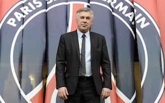 The new coach of the Paris Saint-Germain Carlo Ancelotti of Italy poses on December 30, 2011 at the Parc de Princes stadium in Paris. It has been reported that Ancelotti, twice a Champions League winner in his time with Milan, would become the best-paid coach in the history of the French game on a two-and-a-half-year deal with an annual salary of between six and seven million euros ($7.8m-$9m). AFP PHOTO / BERTRAND GUAY (Photo credit should read BERTRAND GUAY/AFP/Getty Images)