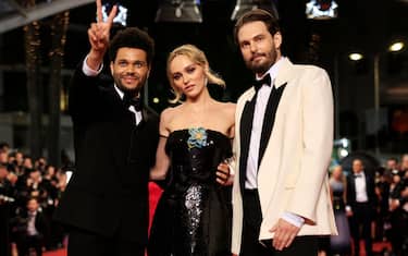 (From L) Canadian singer Abel Makkonen Tesfaye aka The Weeknd, French-US actress Lily-Rose Depp and US director Sam Levinson arrive for the screening of the film "The Idol" during the 76th edition of the Cannes Film Festival in Cannes, southern France, on May 22, 2023. (Photo by Valery HACHE / AFP) (Photo by VALERY HACHE/AFP via Getty Images)