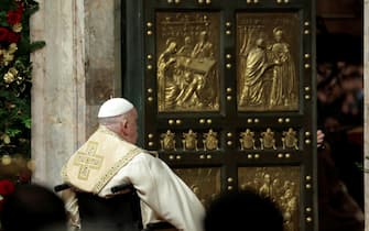 Pope Francis opens the Holy Door to mark the opening of the 2025 Catholic Holy Year, or Jubilee, in St. Peter's Basilica, at the Vatican, December 24, 2024. REUTERS/Remo Casilli/Pool