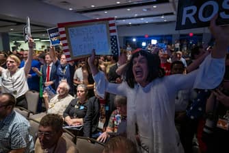 A Libertarian party member shouts protests as former US President and Republican presidential candidate Donald Trump addresses the Libertarian National Convention in Washington, DC, May 25, 2024. (Photo by Jim WATSON / AFP) (Photo by JIM WATSON/AFP via Getty Images)