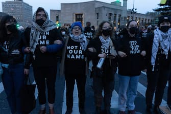 NEW YORK, NEW YORK - APRIL 23: Jews and supporters hold a Passover Seder to protest the war in Gaza on April 23, 2024 in the Brooklyn borough of New York City. The event, which resulted in dozens of arrests, was held blocks from the residence of U.S. Sen. Chuck Schumer (D-NY). Schumer is a longtime supporter of Israel but has recently criticized President Benjamin Netanyahu for Israel's conduct in the war. (Photo by Andrew Lichtenstein/Corbis via Getty Images)