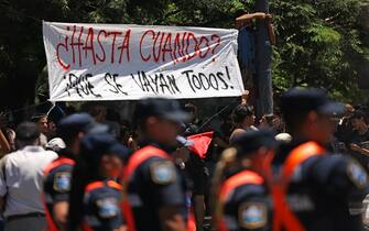 People take part in a demonstration during a national strike against the government of Javier Milei in Cordoba, Argentina on January 24, 2024. Argentine President Javier Milei faces the first national strike in just 45 days of government, against his draconian fiscal adjustment and his plan to reform more than a thousand laws and regulations that governed for decades. The largest Argentine union called the strike in rejection, in particular, of the changes by decree to the labor regime promoted by Milei, which limit the right to strike and affect the financing of unions. (Photo by Nicolas Aguilera / AFP) (Photo by NICOLAS AGUILERA/AFP via Getty Images)