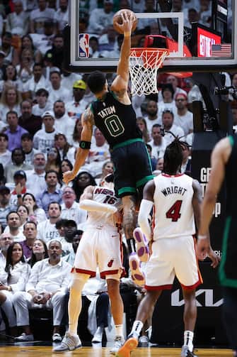 MIAMI, FLORIDA - APRIL 29: Jayson Tatum #0 of the Boston Celtics dunks the ball against Caleb Martin #16 of the Miami Heat during the fourth quarter in game four of the Eastern Conference First Round Playoffs at Kaseya Center on April 29, 2024 in Miami, Florida.  NOTE TO USER: User expressly acknowledges and agrees that, by downloading and or using this photograph, User is consenting to the terms and conditions of the Getty Images License Agreement. (Photo by Megan Briggs/Getty Images)