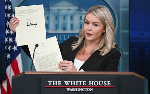 White House Press Secretary Karoline Leavitt holds a letter from US President Donald Trump addressed to South Korean President Lee Jae-myung as she speaks during the daily briefing in the Brady Briefing Room of the White House in Washington, DC, on July 7, 2025. US President Donald Trump said Monday he was slapping 25 percent tariffs on Japan and South Korea, in his first letters to trading partners ahead of a deadline to reach a deal with Washington. Trump had said at the weekend that starting from Monday he would send a first batch of up to 15 letters to countries informing them that he would reimpose harsh levies that he had postponed in April. In near-identically worded letters to the Japanese and South Korean leaders, Trump said the tariffs would apply from August 1 because their trading relationships with Washington were "unfortunately, far from Reciprocal." (Photo by ANDREW CABALLERO-REYNOLDS / AFP)