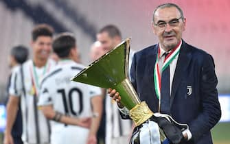 Head coach Maurizio Sarri jubilate with the cup during the celebrations for the Juventus' victory of the 9th consecutive Italian championship (scudetto) at Allianz Stadium in Turin, Italy, 01 August 2020. ANSA/ALESSANDRO DI MARCO