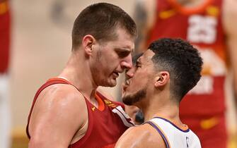 DENVER, CO - JUNE 13:  Nikola Jokic #15 of the Denver Nuggets and Devin Booker #1 of the Phoenix Suns exchange words after a play that would result in Jokic being ejected in the third quarter in Game Four of the Western Conference second-round playoff series at Ball Arena on June 13, 2021 in Denver, Colorado. NOTE TO USER: User expressly acknowledges and agrees that, by downloading and or using this photograph, User is consenting to the terms and conditions of the Getty Images License Agreement. (Photo by Dustin Bradford/Getty Images)
