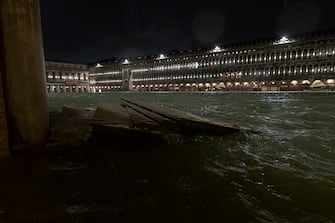 VENICE, ITALY - NOVEMBER 12: The wooden walkways float in Piazza San Marco after the passage of the exceptional high tide that reached 187 cm on November 12, 2019 in Venice, Italy. High tide, or acqua alta as it is more commonly known, stood at 126 centimeters this morning. (Photo by Stefano Mazzola/Awakening/Getty Images)