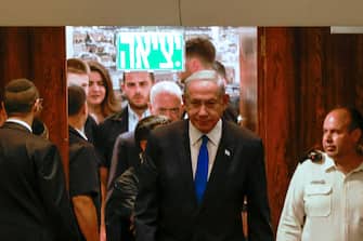 Israel's Prime Minister Benjamin Netanyahu (C) arrives for a parliament (Knesset) meeting in Jerusalem on July 10, 2023. (Photo by Menahem KAHANA / AFP) (Photo by MENAHEM KAHANA/AFP via Getty Images)
